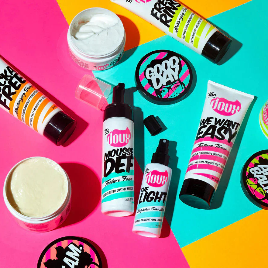 he Doux producten voor krullend haar – shampoo, leave-in conditioner en styling mousse.